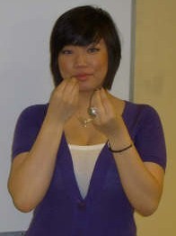 ASL sign for eat: fingertips tap the lips
