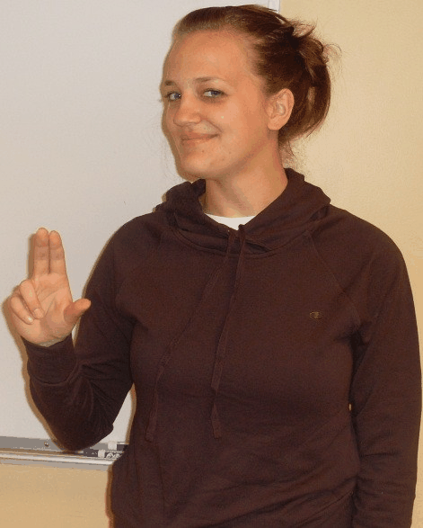 Animated ASL sign for no, step 1: index and middle finger extended above the thumb