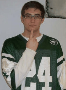 Animated ASL sign for red, step 1: index finger touching the chin below the lip