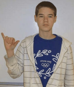 Animated ASL sign for yellow, step 1: Y-shaped hand held up at the side