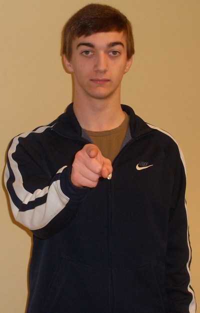 ASL sign for you: index finger aimed directly outward